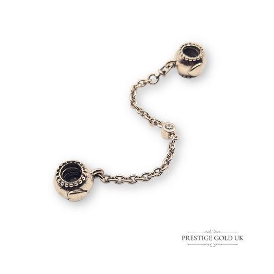 Authentic Pandora sterling silver safety chain with embossed heart design and CZ stone detail, stamped ALE 925. Measures 66 mm long, weight 5.62 g. A genuine Pandora accessory for charm bracelets, combining elegance with security.