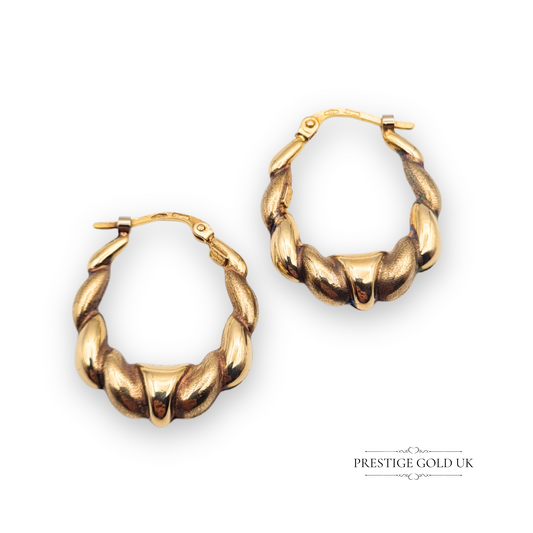Pair of 9ct gold croissant creole earrings with flip top closures, featuring a curved and twisted gold design, lightweight at 1.60g, 24mm x 20mm size, stamped 375
