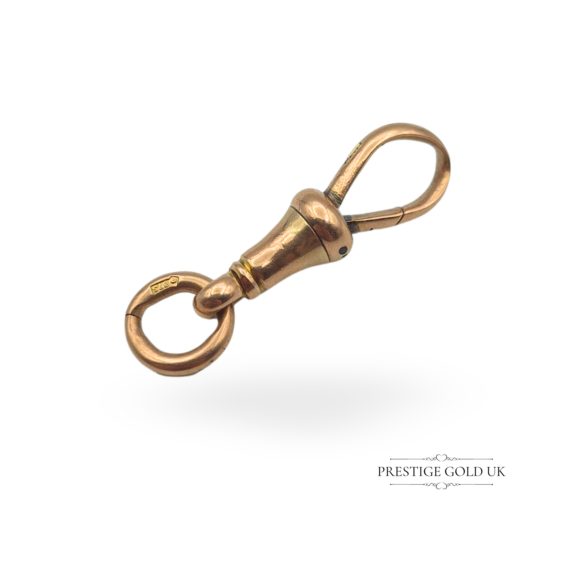 Antique 9ct rose gold dog clip, stamped 375, measuring 23mm long (28mm with jump ring). A classic Victorian accessory for Albert chains, pocket watches, or charms. Features a warm rose gold hue with a well-used patina, making it a perfect addition to vintage jewellery collections.