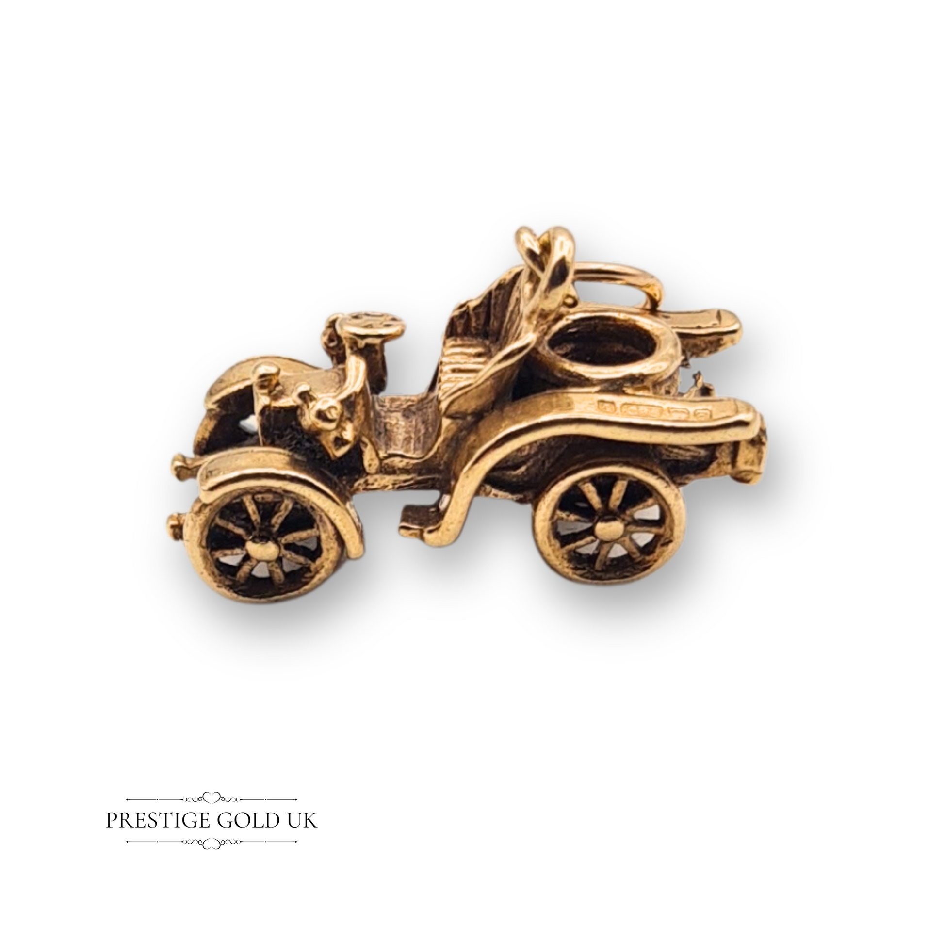 9ct gold vintage car charm, hallmarked Birmingham 1965, detailed spoked wheels and curved bonnet, 19mm by 8mm, solid gold miniature vehicle charm
