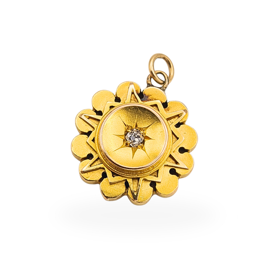 9ct gold round pendant with starburst design and central old cut diamond