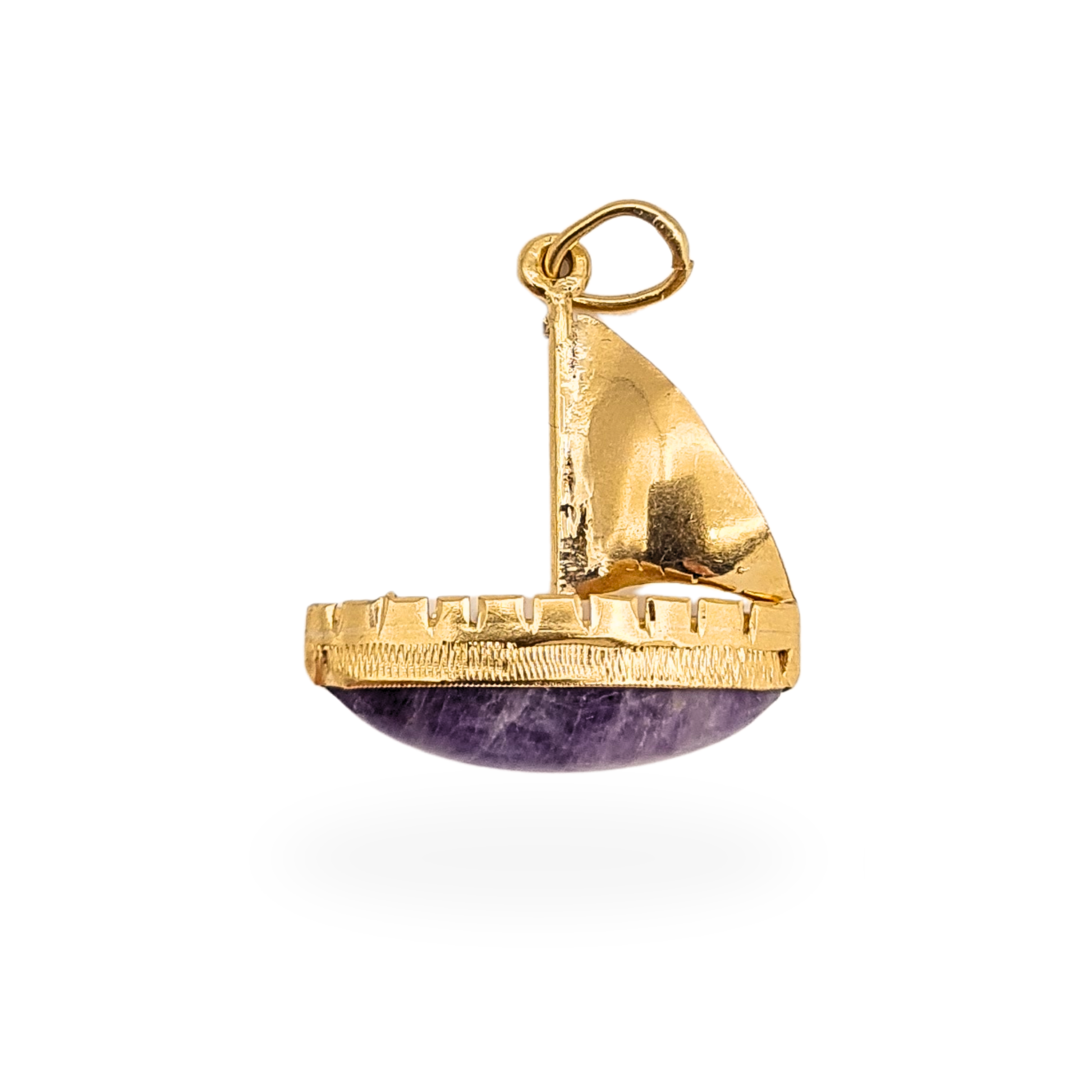 14ct yellow gold sailboat charm featuring a curved purple quartz cabochon forming the boat hull, nautical pendant design measuring approximately 18mm tall and 16mm wide, lightweight charm weighing 1.3g, fully tested 14k gold despite no visible hallmark.
