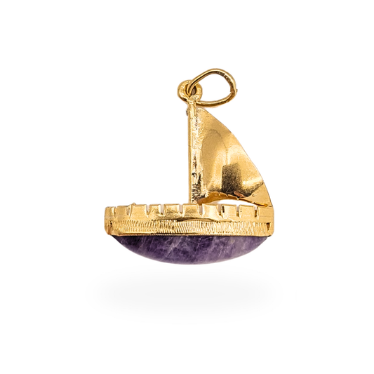 14ct yellow gold sailboat charm featuring a curved purple quartz cabochon forming the boat hull, nautical pendant design measuring approximately 18mm tall and 16mm wide, lightweight charm weighing 1.3g, fully tested 14k gold despite no visible hallmark.
