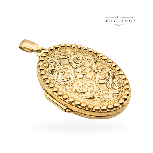 9ct gold oval floral engraved locket, hallmarked Birmingham 1993. Vintage solid gold photo locket with beaded edge and polished back, opens to hold two photos, 29mm x 14mm, 3.24g. Elegant keepsake pendant.