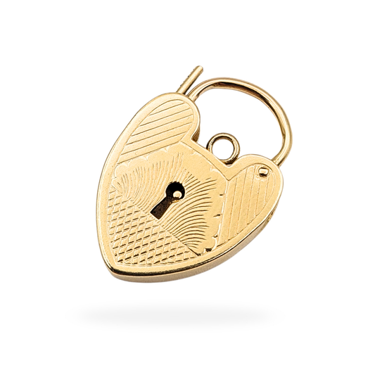 Vintage 9ct gold heart padlock pendant hallmarked in London 1969, featuring engraved geometric detailing and a working opening clasp. Solid gold charm measuring 25mm by 16mm, classic love token design with original vintage finish.
