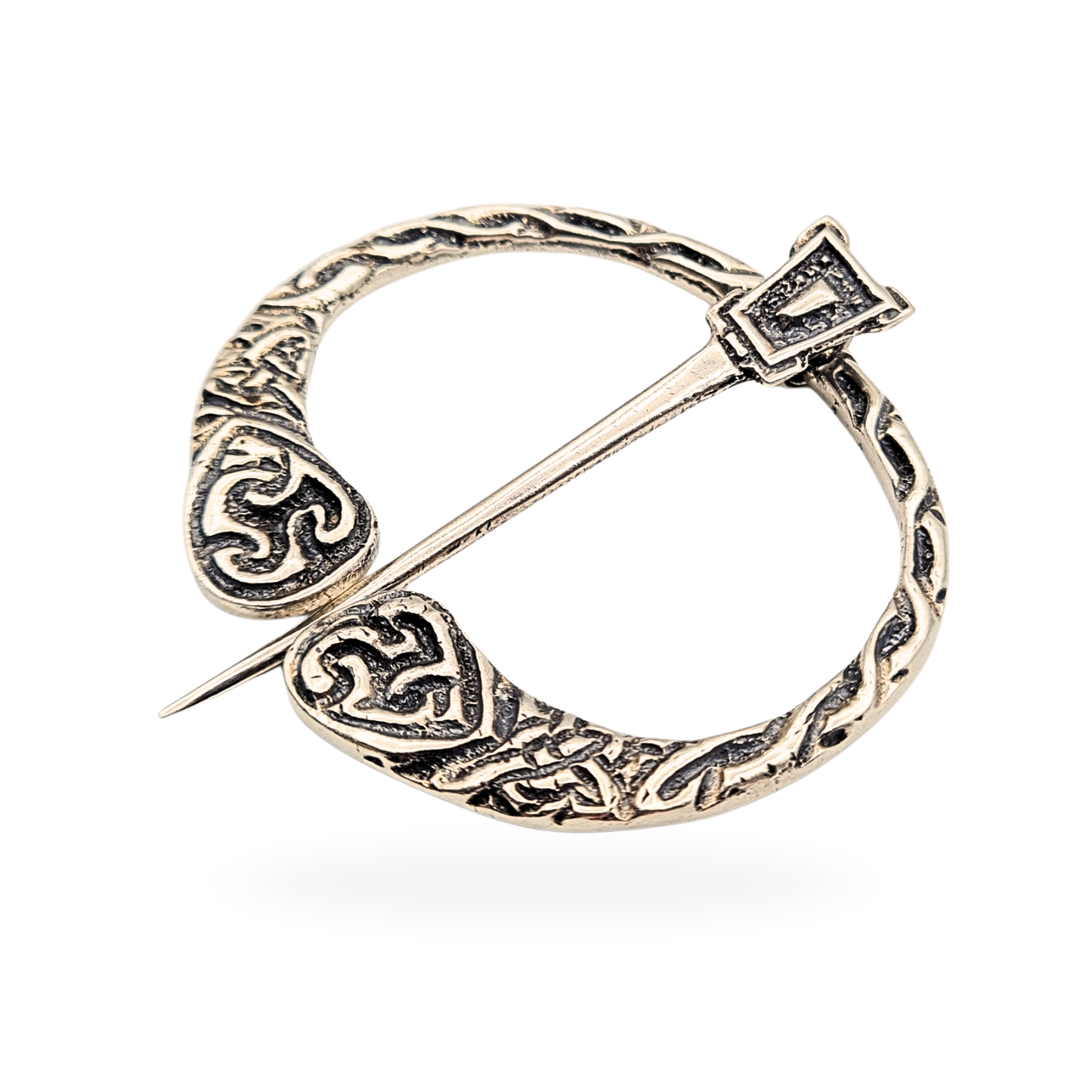 Scottish silver Celtic penannular kilt or cloak pin, hallmarked Birmingham 1935, weighing 10.4g and measuring 45mm by 43mm. Features heart-shaped terminals with engraved knotwork and rope-textured detailing, a fine example of traditional Celtic silverwork.