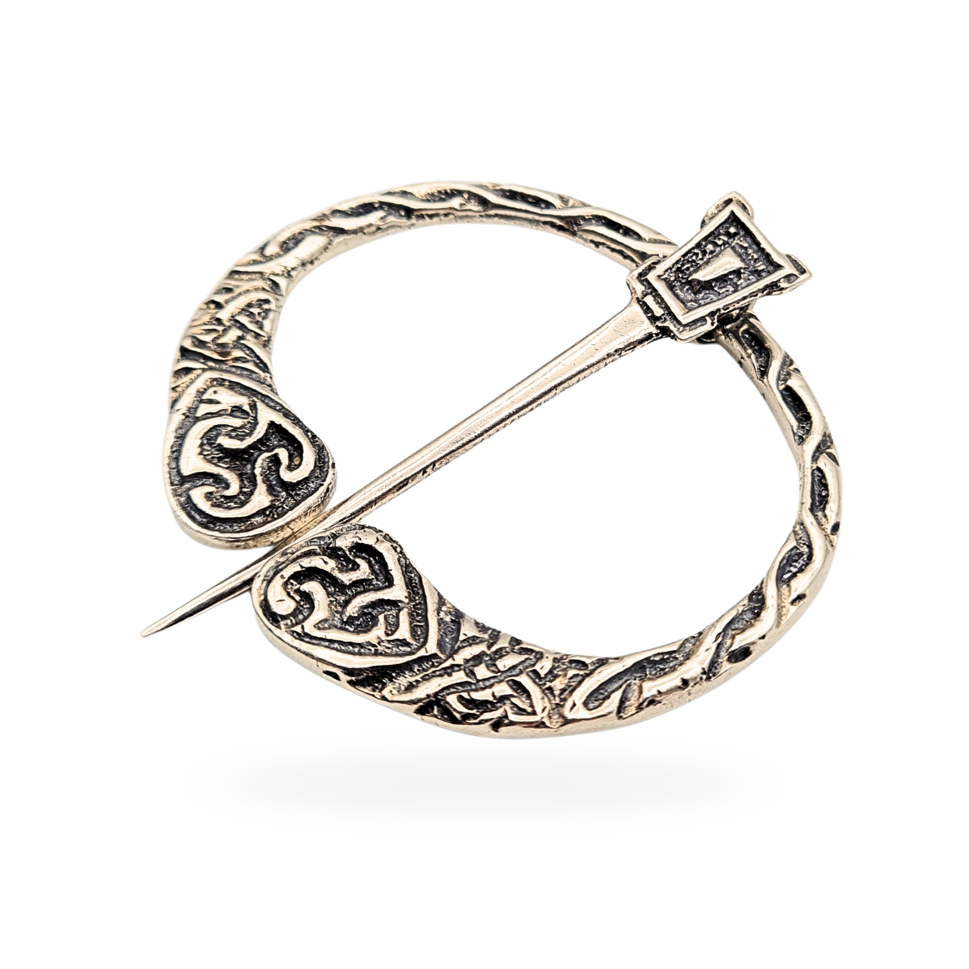 Scottish silver Celtic penannular kilt or cloak pin, hallmarked Birmingham 1935, weighing 10.4g and measuring 45mm by 43mm. Features heart-shaped terminals with engraved knotwork and rope-textured detailing, a fine example of traditional Celtic silverwork.