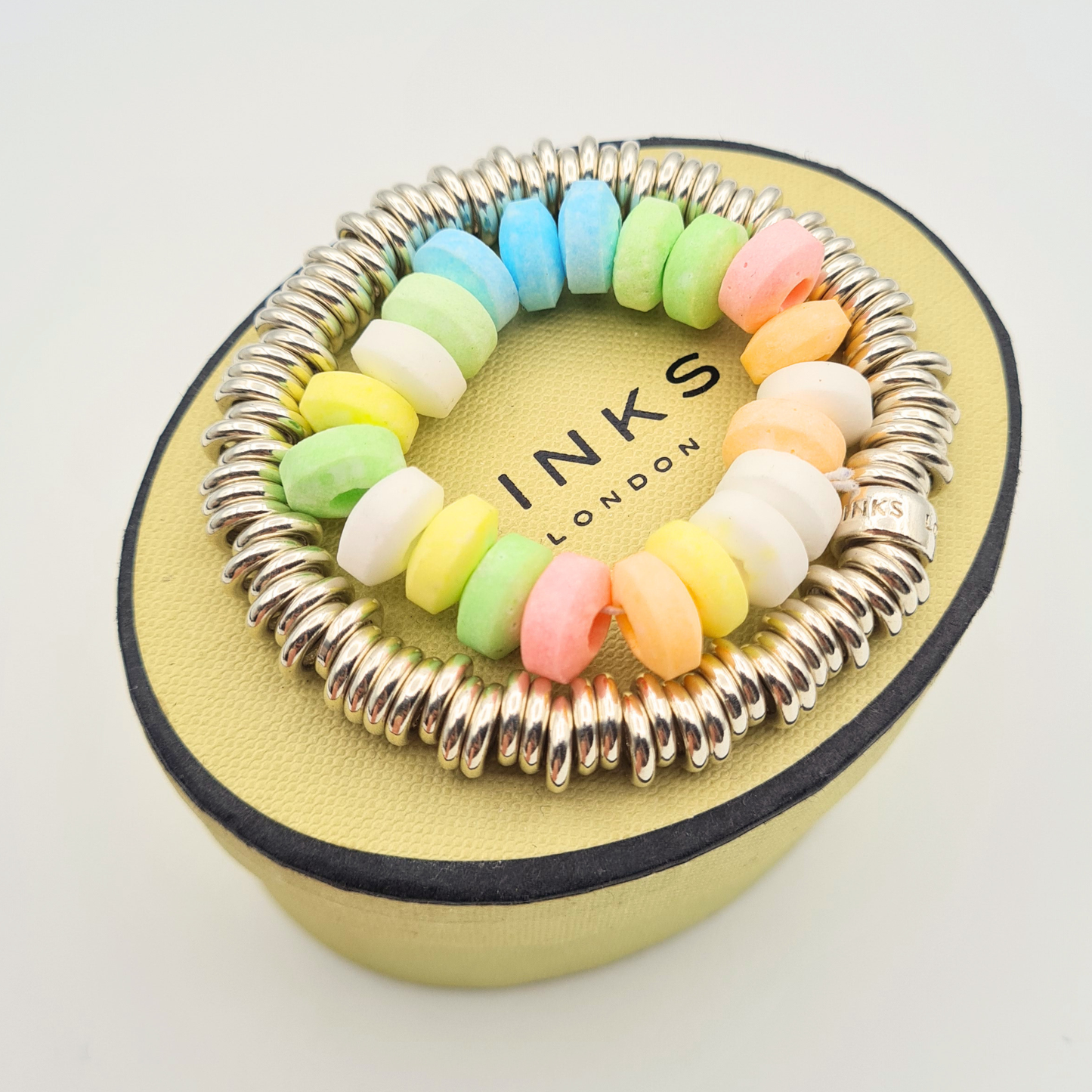 Sterling silver Links of London Sweetie bracelet with polished ring link design and elastic construction, measuring 16cm, fully hallmarked with branded bead detail, chunky silver bracelet shown on wrist, ruler and presentation box