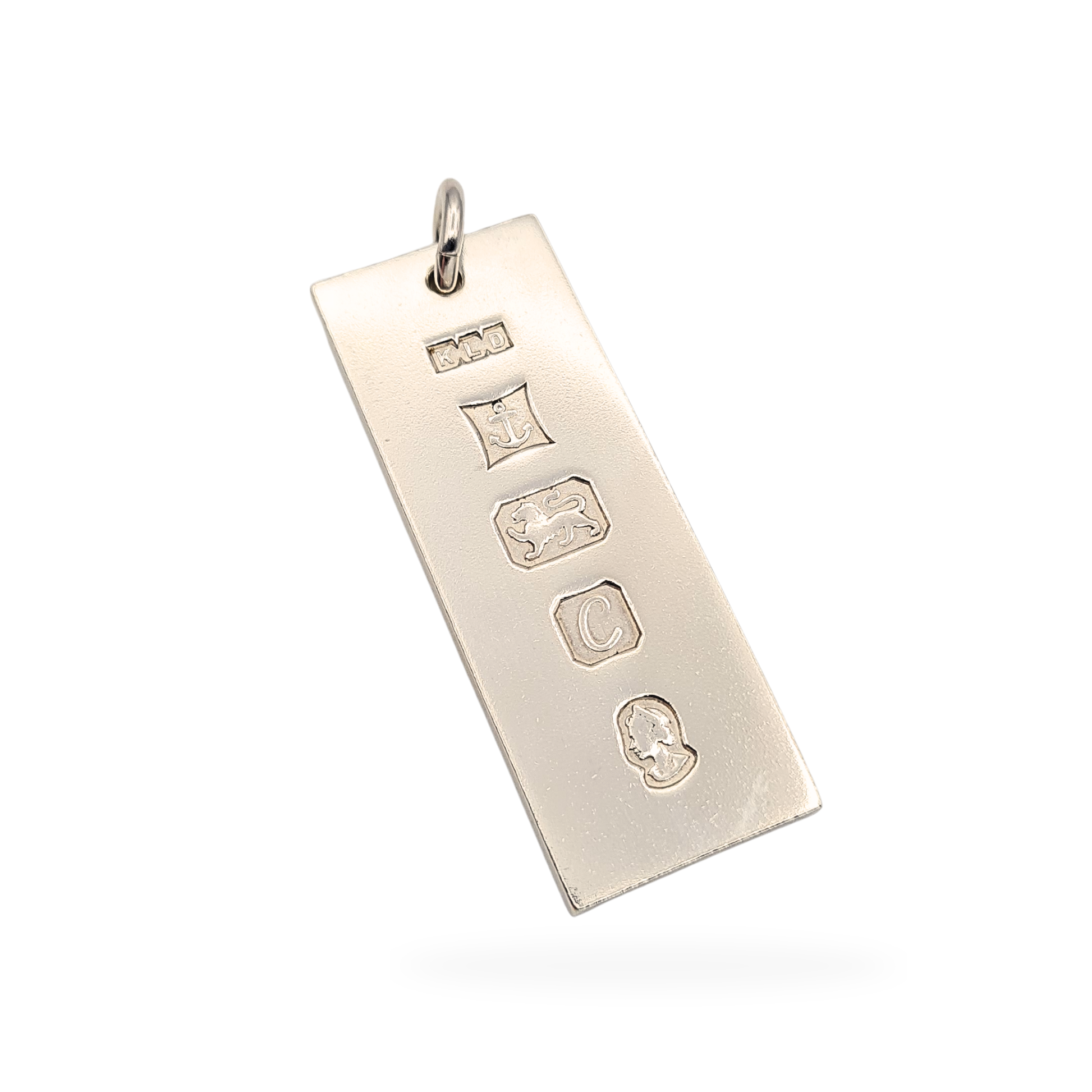 Sterling silver 925 ingot pendant, fully British hallmarked with lion passant and anchor assay marks, measuring 51mm tall, 19mm wide and 3mm deep, weighing 30.9g. Large vintage solid silver bar pendant with substantial weight and classic statement styling.

