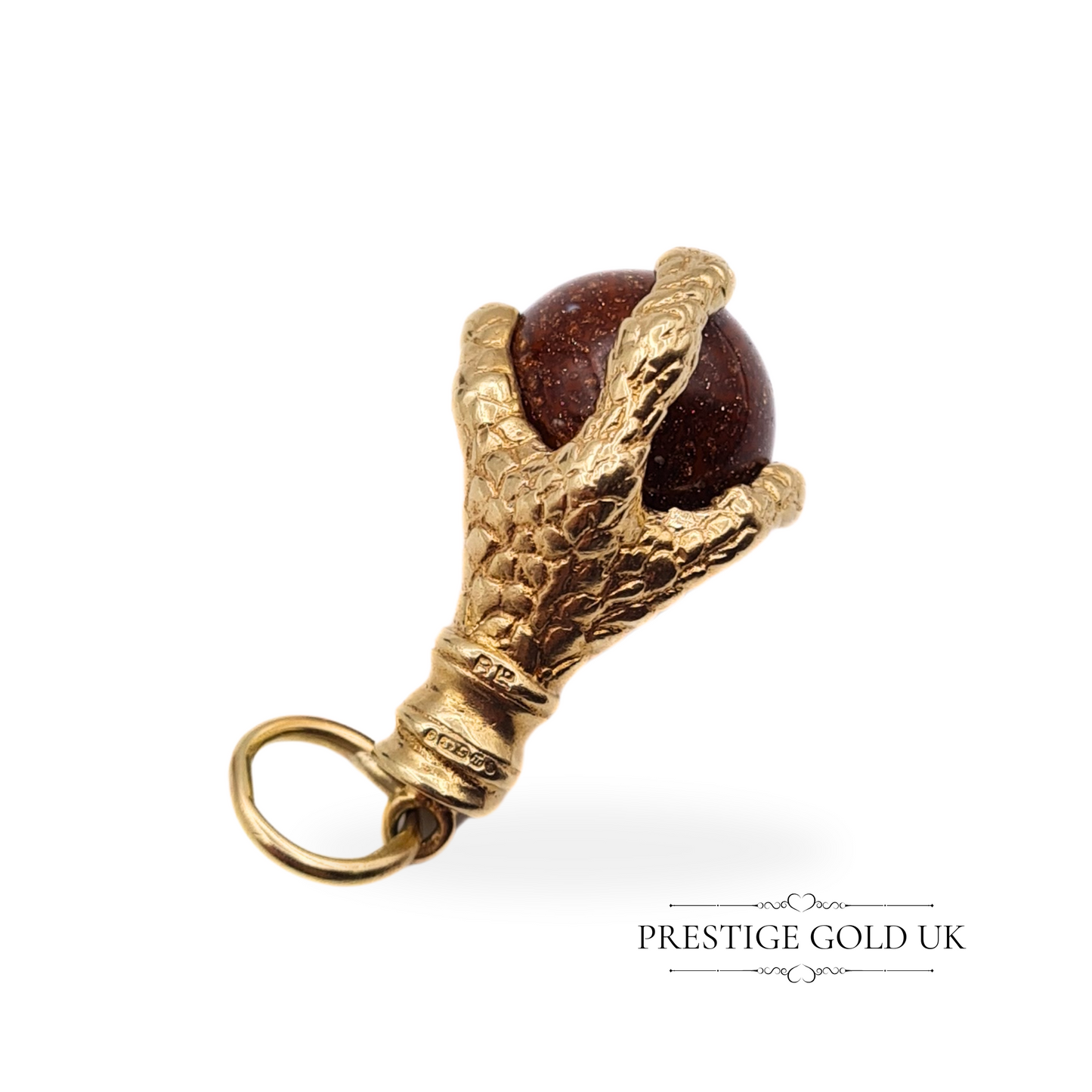 Side view of the dragon claw charm, showing the textured claw design and glowing moonstone sphere.