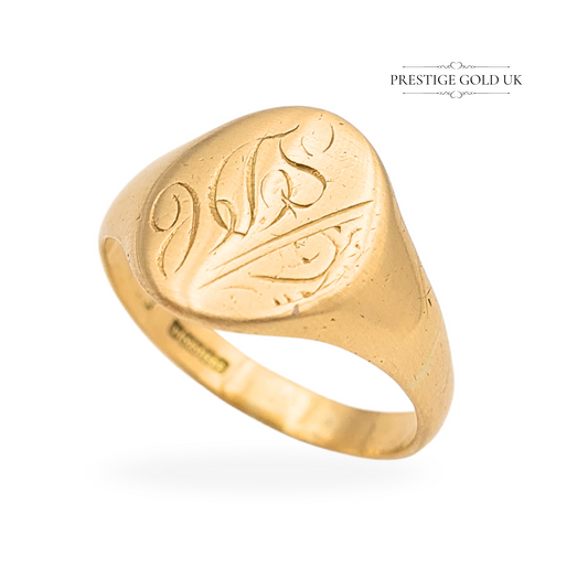 9ct gold engraved signet ring weighing 3.73g, hallmarked Birmingham 1989, size UK S (US 9), with an oval 14mm x 11mm monogrammed face, fully British hallmarked, a bold and characterful vintage gold signet ring.