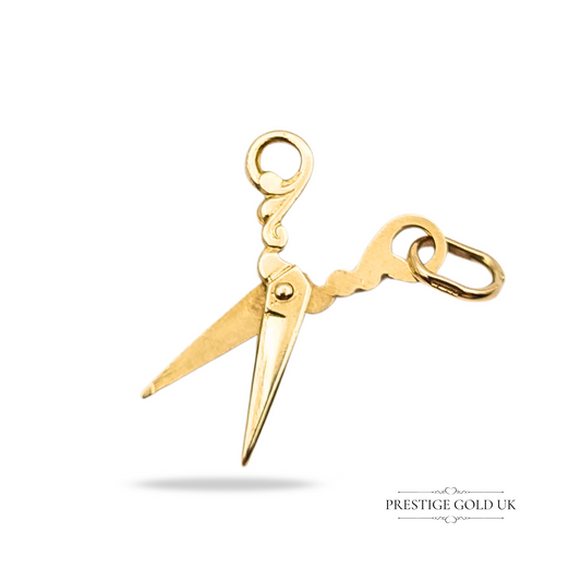 Vintage 9ct gold charm pendant shaped as a pair of ornate opening scissors, fully hallmarked Birmingham 1988, with detailed miniature tool design and polished finish, ideal as a collector’s charm or gift for sewing enthusiasts.