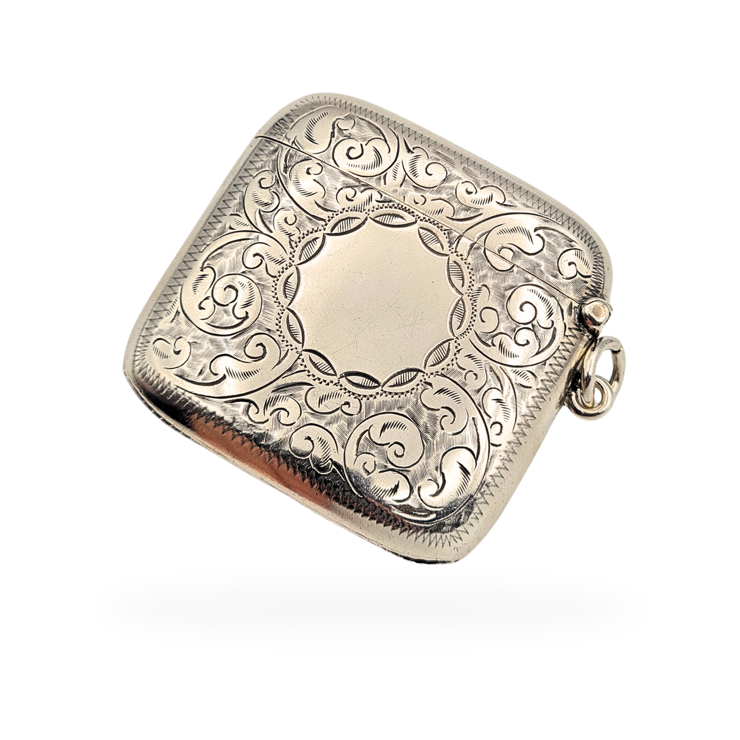Antique sterling silver large curved hip vesta case, hallmarked Birmingham 1918 by J.C Ltd, measuring 50mm tall, 55mm wide and 10mm deep, weighing 30.17g. Hand engraved scroll decoration with central cartouche and traditional striker base.
