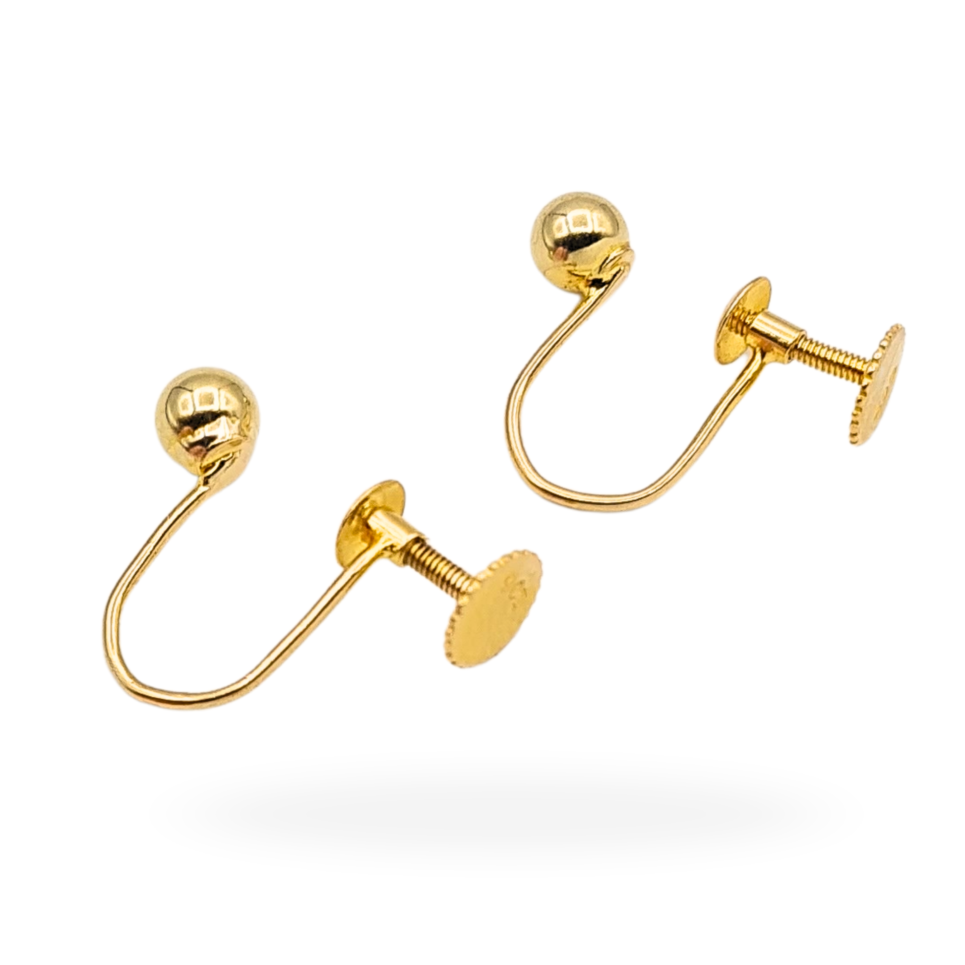 Pair of solid 9ct yellow gold screw back earrings featuring smooth 4mm ball studs, fully tested and stamped 9ct. Lightweight 0.86g design with secure threaded backs, photographed on vintage box and shown worn for scale.