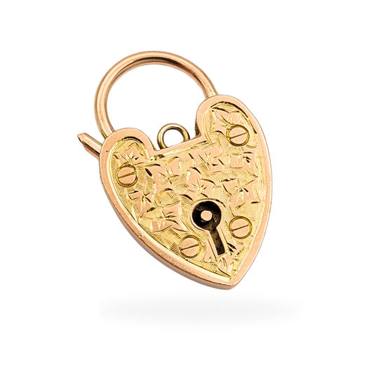 Heart-shaped 9ct rose gold padlock pendant with hand-engraved ivy leaf detailing and working opening clasp. Measuring 25mm tall, 16mm wide and 2.75mm thick, stamped and tested 9ct gold, with a classic keyhole design and warm rose gold tone.