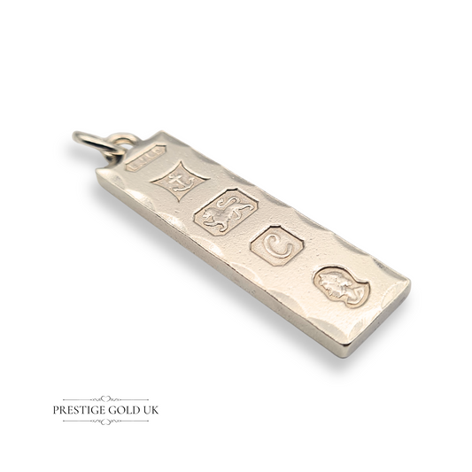 Solid 925 sterling silver large ingot pendant, weighing 14.3 grams, measuring 46mm x 12mm x 3mm, hallmarked Birmingham 1977 with maker’s mark EJLD, anchor, lion passant, letter C date mark, duty mark, polished with fancy faceted edges.