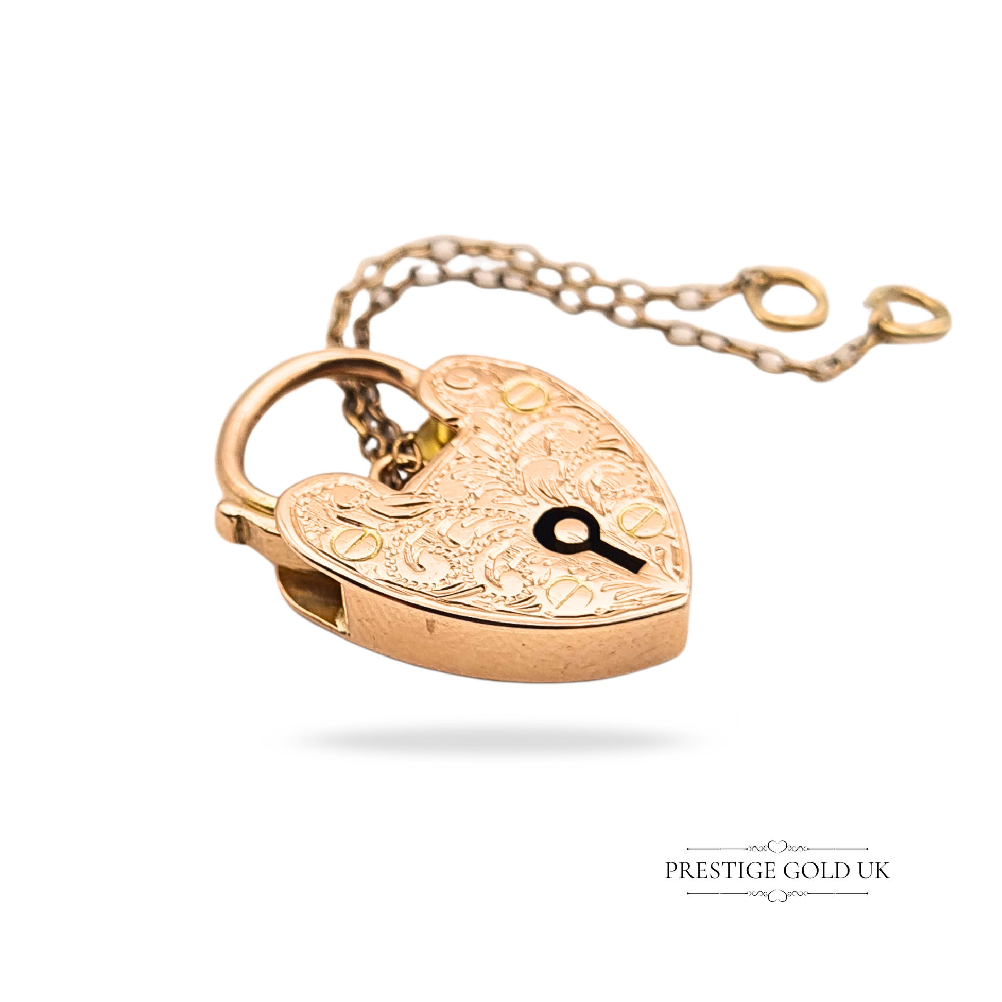 Antique 9ct rose gold heart padlock pendant with hand engraving, measuring 21mm by 14mm, stamped 9ct and fully tested, complete with original safety chain, 2.9g weight, Edwardian style detail, unique collector’s jewellery.