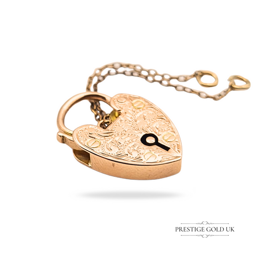 Antique 9ct rose gold heart padlock pendant with hand engraving, measuring 21mm by 14mm, stamped 9ct and fully tested, complete with original safety chain, 2.9g weight, Edwardian style detail, unique collector’s jewellery.