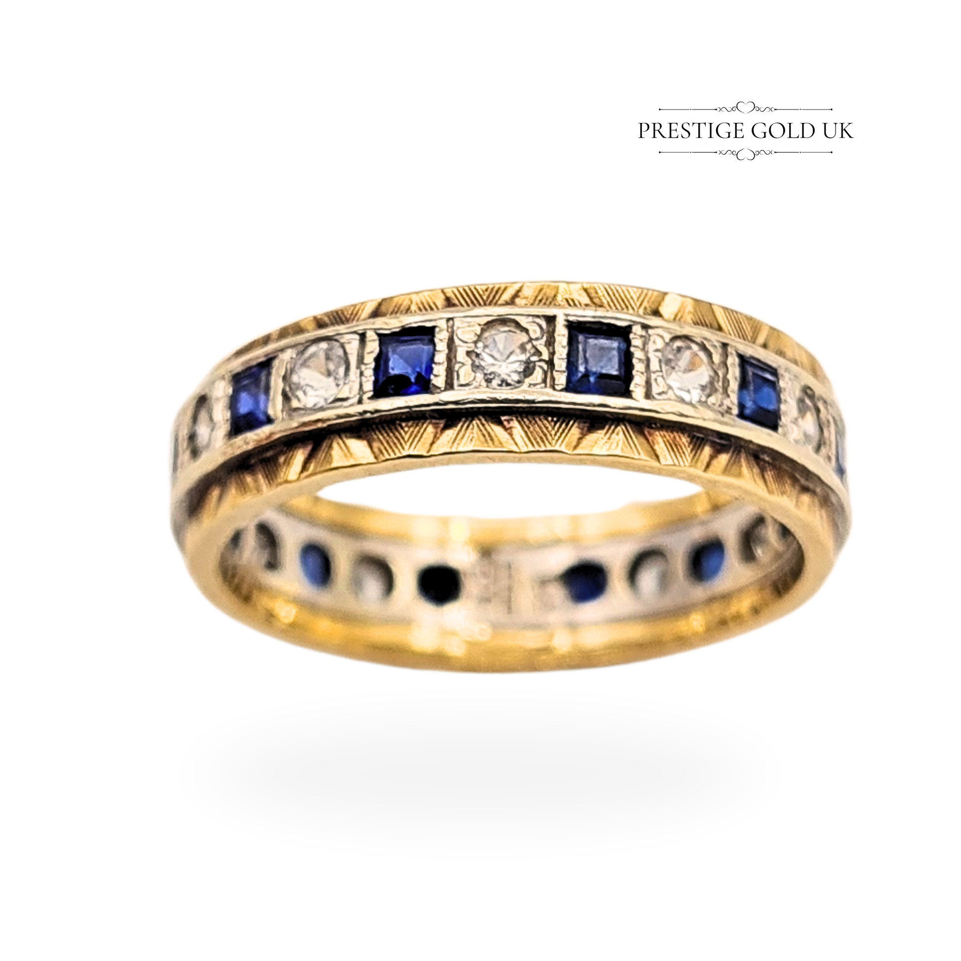 Vintage 9ct white and yellow gold sapphire and spinel full eternity ring hallmarked Birmingham 1989, UK size O / US 7.25, 5.5mm wide band with alternating square sapphires and round spinels, engraved detail and two-tone finish, weight 3.9g.