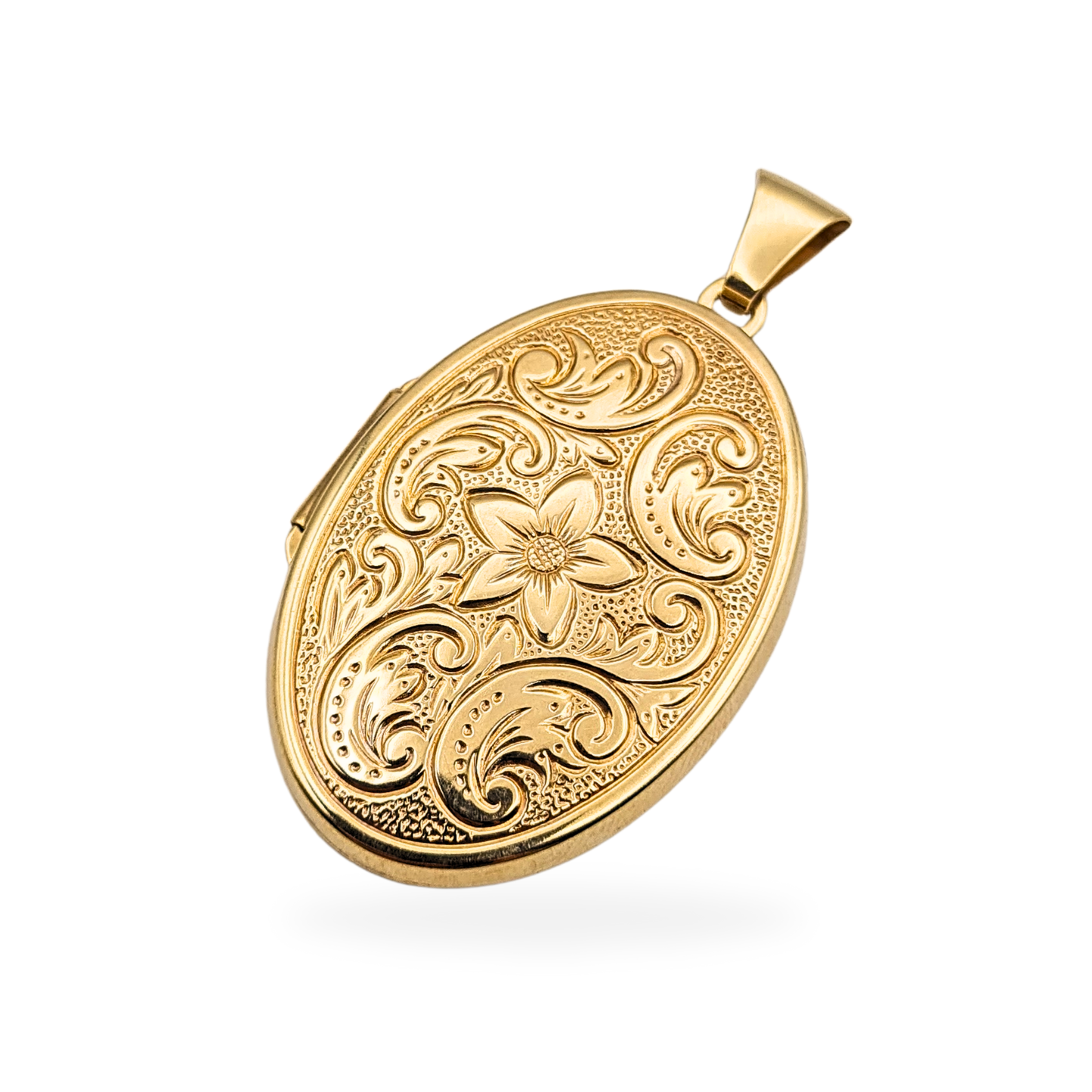 Large oval 9ct gold locket with intricate floral engraving on the front and a smooth polished back. Fully British hallmarked and tested. Measures 35mm tall by 23mm wide. Solid gold keepsake pendant designed to hold two small photos.
