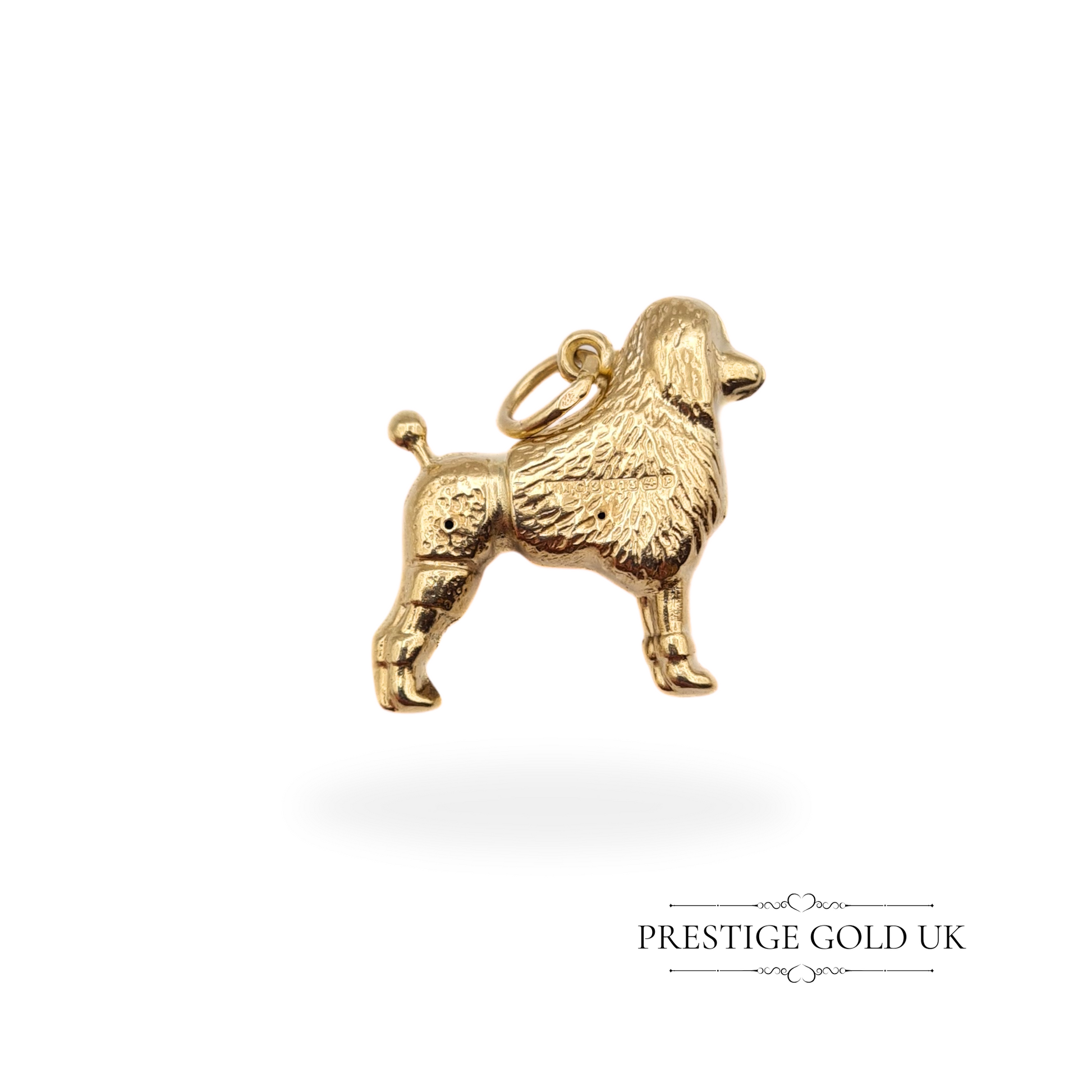 A vintage 9ct gold poodle charm with intricate details, fully hallmarked Birmingham 1964, hollow construction with an open jump ring.