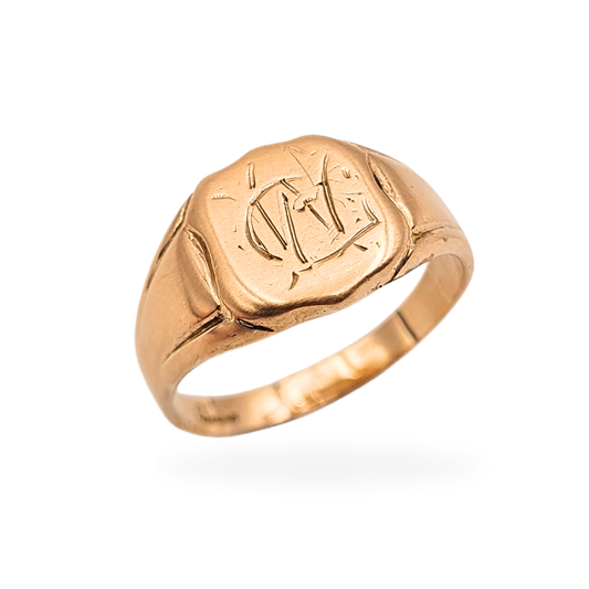 Antique 9ct rose gold signet ring with hand-engraved cushion-shaped face measuring 10 x 10mm. UK size O 1/2 US 7 1/4, weighing 3.4g. Worn hallmarks with evidence of resizing and natural surface wear consistent with age.