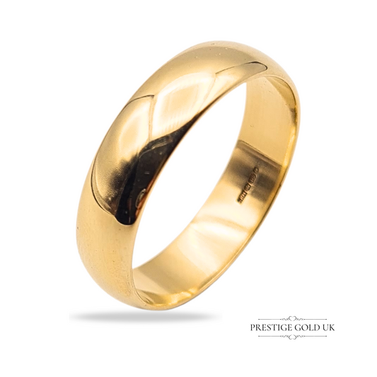 A 9ct gold classic wedding band with a polished rounded profile, 6mm wide, UK ring size Z / US size 12.5, hallmarked Birmingham, traditional and substantial.