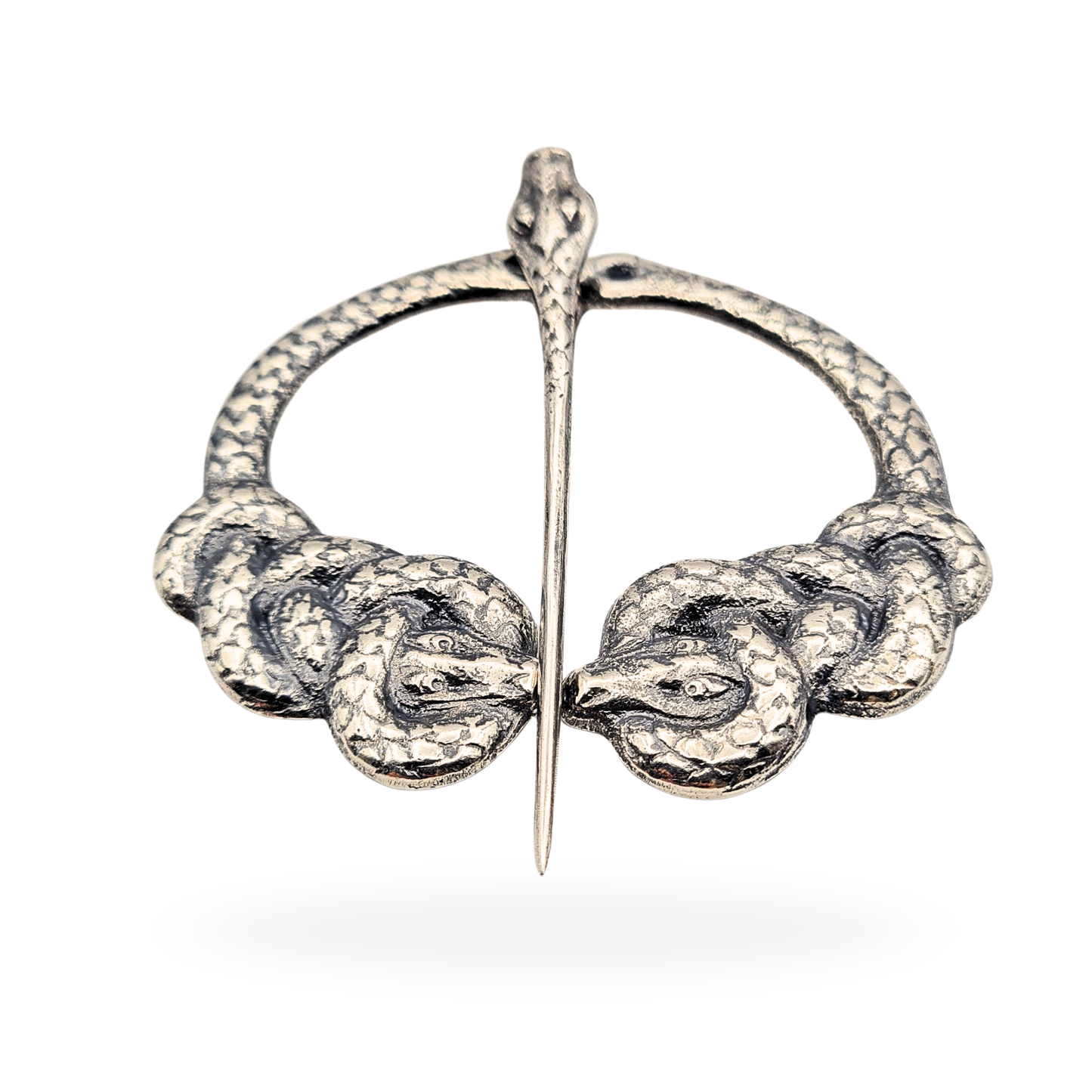 Silver penannular kilt pin by Alexander Ritchie of Iona, hallmarked Glasgow 1930, measuring 64mm by 55mm and weighing 25.8g. Features intertwined serpents and serpent pin detail in traditional Celtic revival style, excellent condition, collectible craftsmanship.