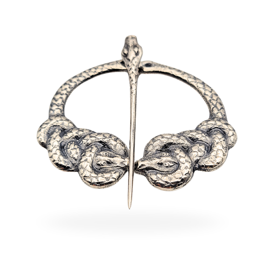 Silver penannular kilt pin by Alexander Ritchie of Iona, hallmarked Glasgow 1930, measuring 64mm by 55mm and weighing 25.8g. Features intertwined serpents and serpent pin detail in traditional Celtic revival style, excellent condition, collectible craftsmanship.