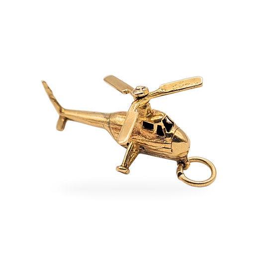 Vintage 9ct gold helicopter charm hallmarked London 1968, measuring 23mm long, 13mm wide and 11mm tall, weighing 1.9g. Detailed aviation pendant with მოძრable rotor blades, cockpit windows and landing skids, shown in close-up with hallmark and scale images.