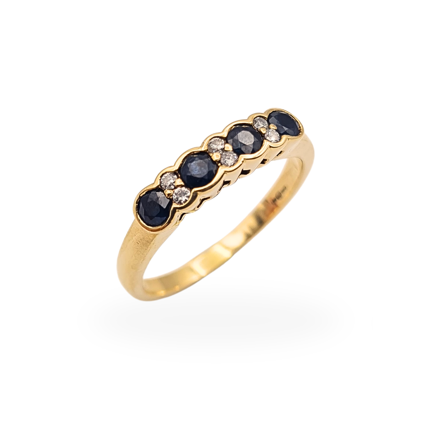 Vintage 9ct yellow gold ring with five round dark blue sapphires and five round diamonds in a flush setting.