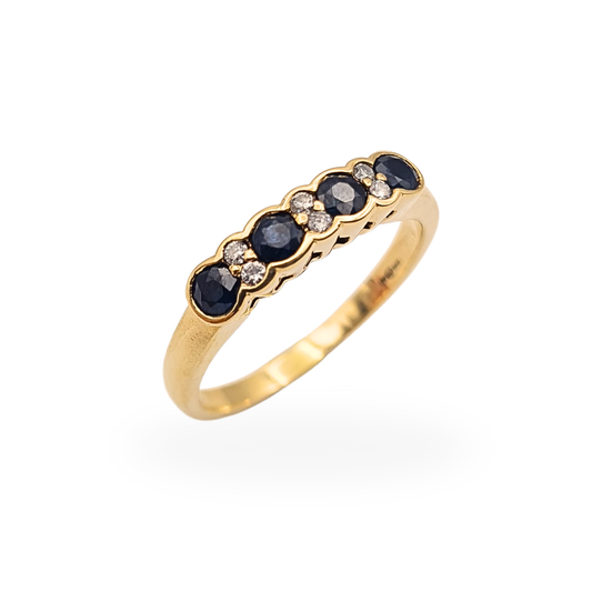 Vintage 9ct yellow gold ring with five round dark blue sapphires and five round diamonds in a flush setting.