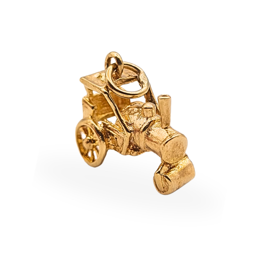 Vintage 9ct yellow gold steam road roller charm with full British hallmarks.