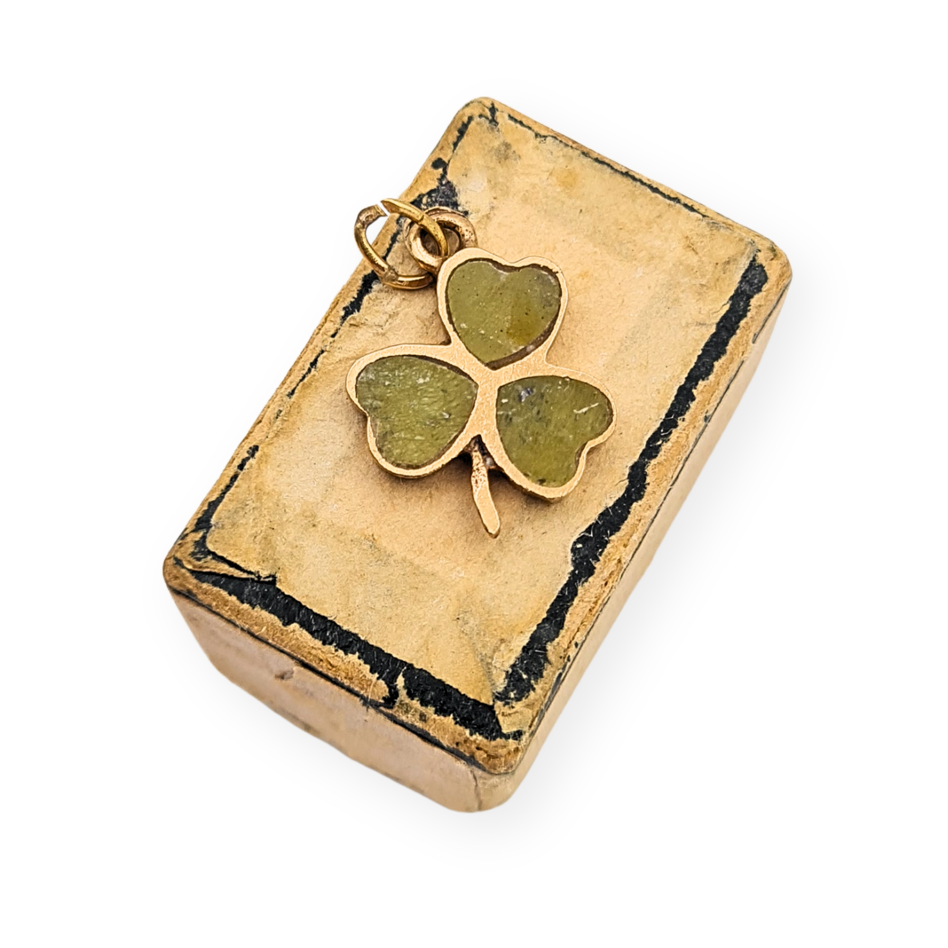 Vintage 9ct yellow gold three leaf clover charm with green inlay leaves, Irish shamrock design measuring 14mm tall by 13mm wide, hallmarked Dublin 1965 with maker’s mark TJH, small lucky charm pendant weighing 1.1g suitable for bracelet or necklace.
