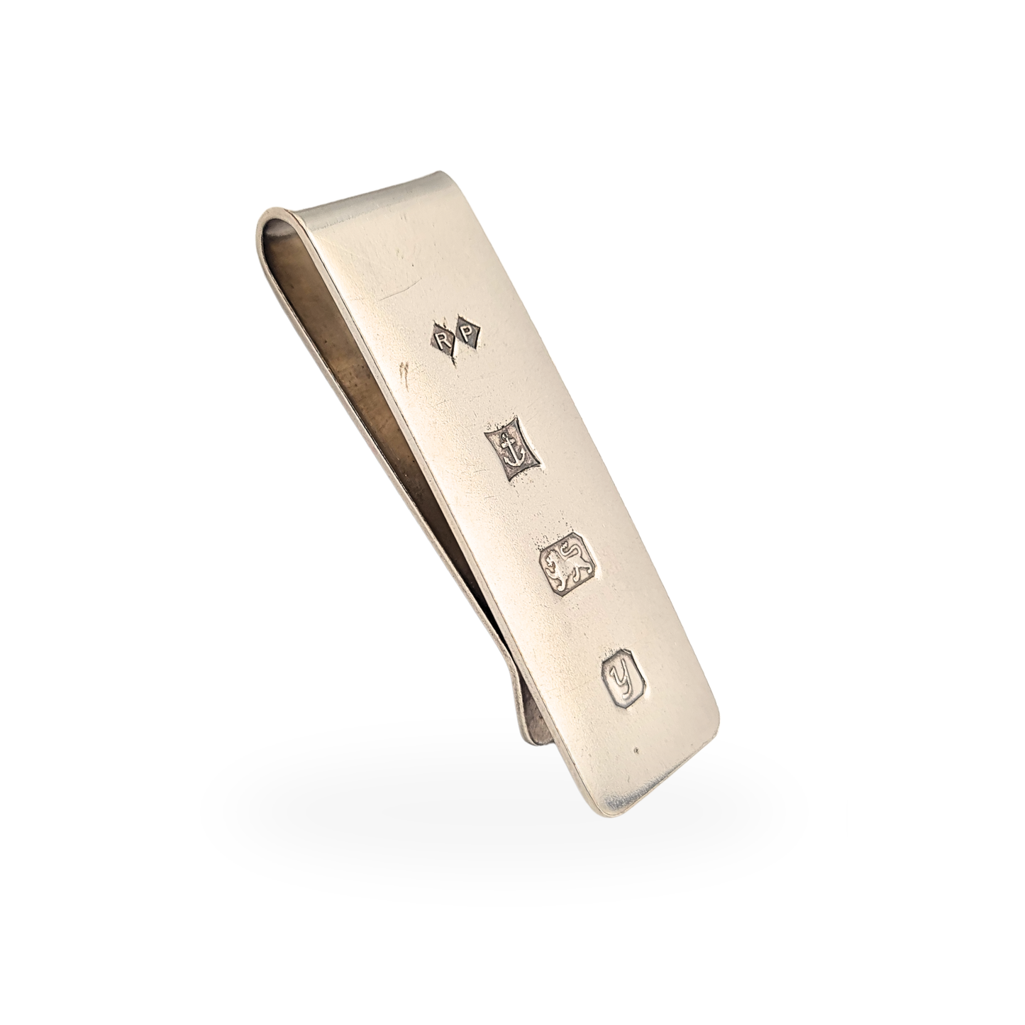 Sterling silver money clip fully hallmarked in Birmingham with 1998 date letter and maker’s mark RP. Solid silver note holder measuring approximately 48mm by 16mm with a clean minimalist design, ideal as a classic gentleman’s wallet accessory.
