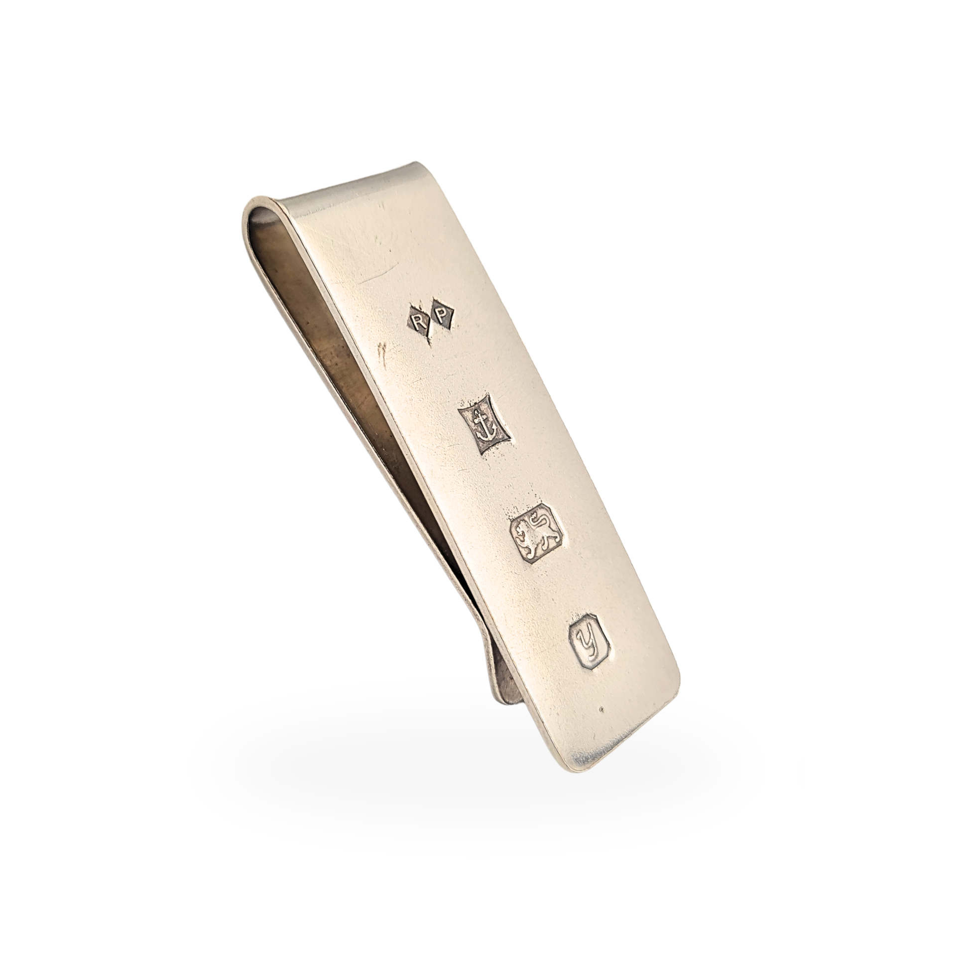 Sterling silver money clip fully hallmarked in Birmingham with 1998 date letter and maker’s mark RP. Solid silver note holder measuring approximately 48mm by 16mm with a clean minimalist design, ideal as a classic gentleman’s wallet accessory.
