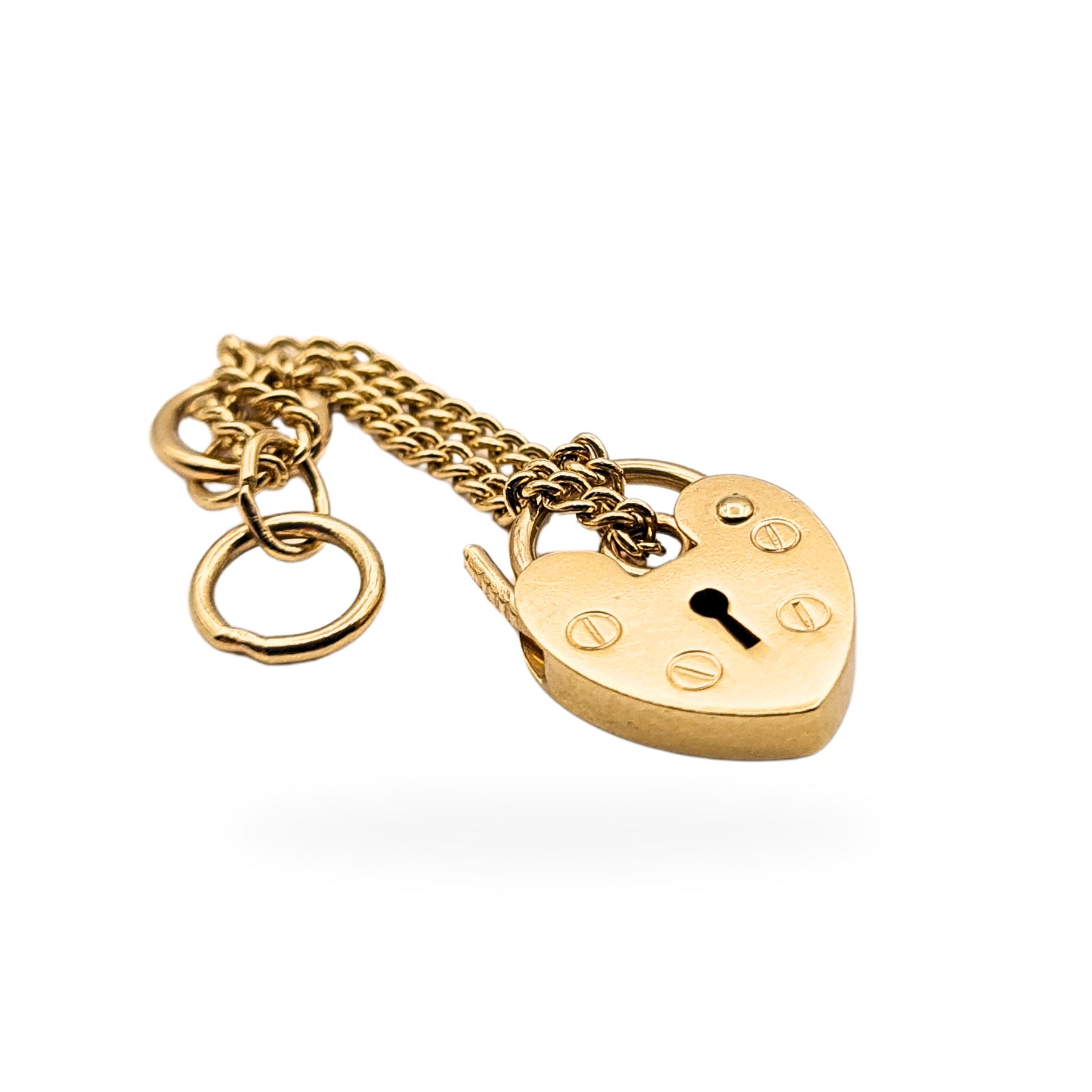 9ct gold heart-shaped padlock with keyhole engraving, 13mm tall by 10mm wide, fitted with 72mm safety chain. Stamped 375 and fully tested for solid gold. Small opening clasp charm suitable for bracelets or necklaces.