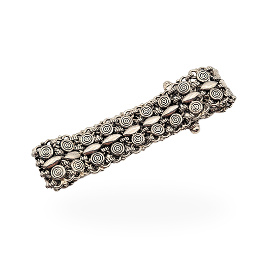 Wide 925 silver bracelet with intricate Indian handmade construction, featuring repeating circular swirl motifs and central navette links, 7 inch length and 20mm width, heavy 54g piece with slide clasp fastening, tested silver with no visible hallmark
