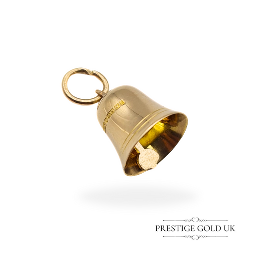 Close-up of a 9ct gold bell charm with clear hallmark details from Birmingham, highlighting its intricate design and open jump ring.