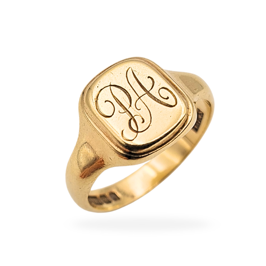 Vintage 9ct gold engraved signet ring with cushion-shaped face measuring 13 x 11mm, hand engraved with the initials PA. Fully hallmarked 375 gold with Birmingham assay marks, UK size V / US size 10 1/2, showing light age wear consistent with careful vintage use.
