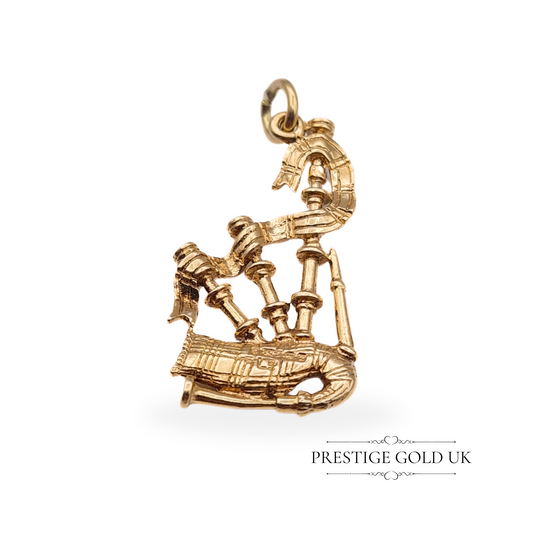 Vintage 9ct gold bagpipes charm pendant with intricate detailing, fully British hallmarked in Birmingham, 1974.