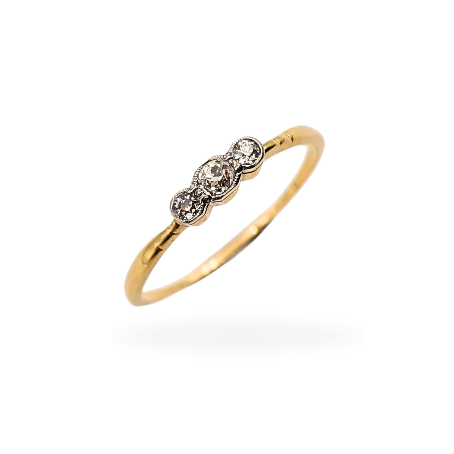 18ct yellow gold antique-style trilogy ring set with three old cut diamonds, fully tested gold with no hallmark, slim narrow shank and softly worn finish, ring size UK Q 1/2 US 8 1/4, lightweight 1.4g diamond ring with vintage character.
