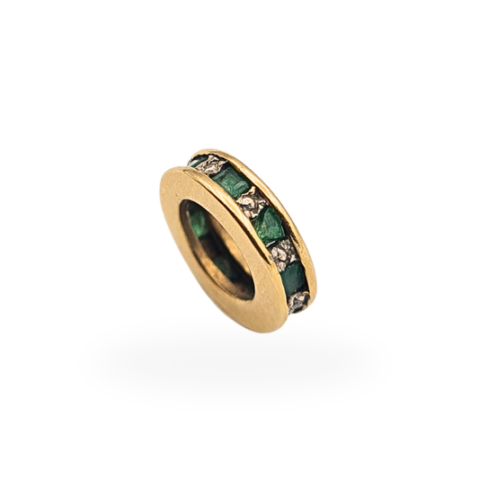 Small 9ct yellow gold round spacer charm set with emeralds and white accent stones, fully tested, measuring 10mm in diameter.