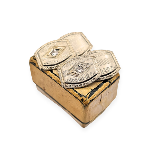 10ct white gold diamond cufflinks in an Art Deco style, stamped 10k and fully tested, each cufflink 14x12mm with detailed engraving and a single diamond centre, lightweight 3.4g design, ideal gents accessory or collector’s gift.
