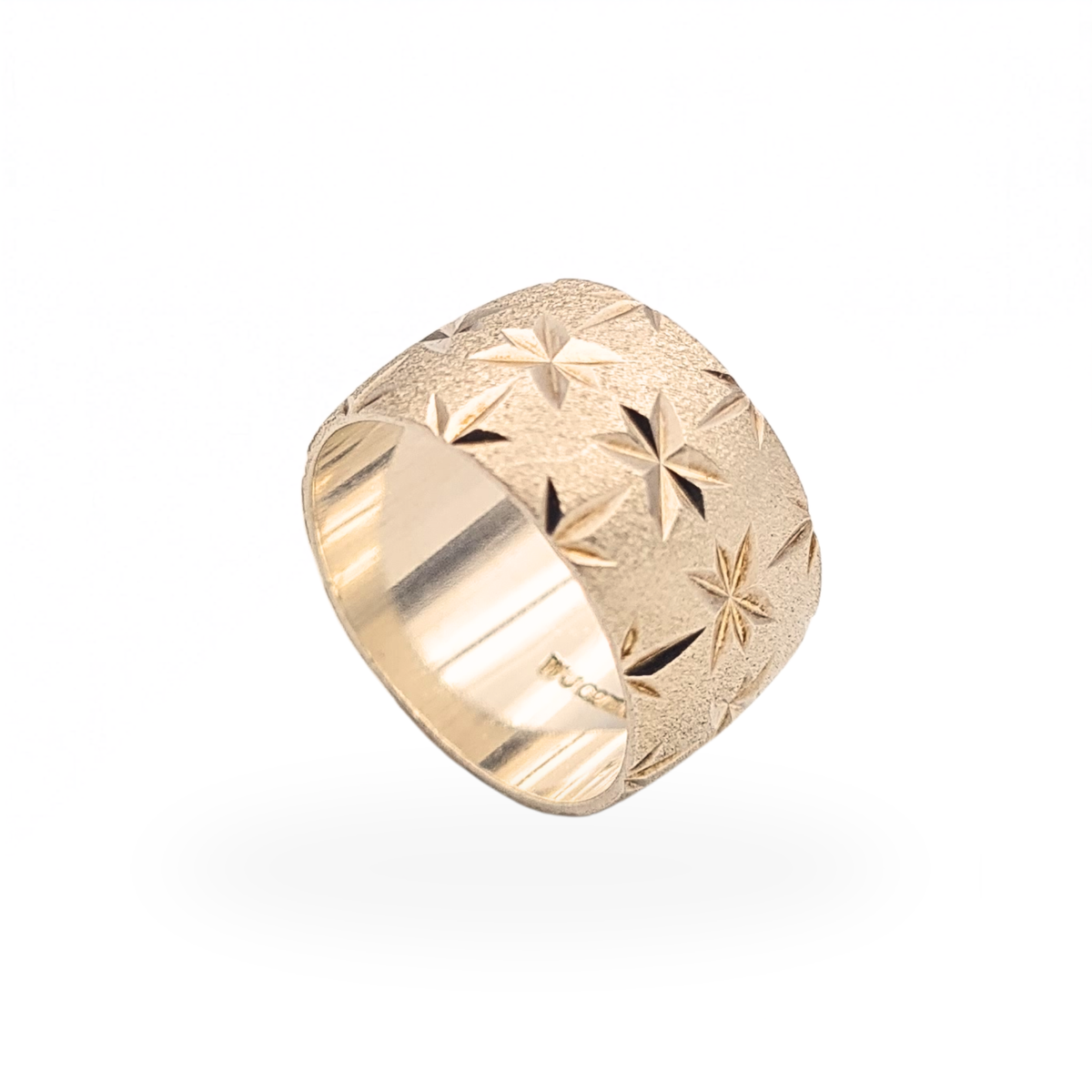 Sterling silver wide cigar band ring with textured satin finish and polished engraved star pattern
