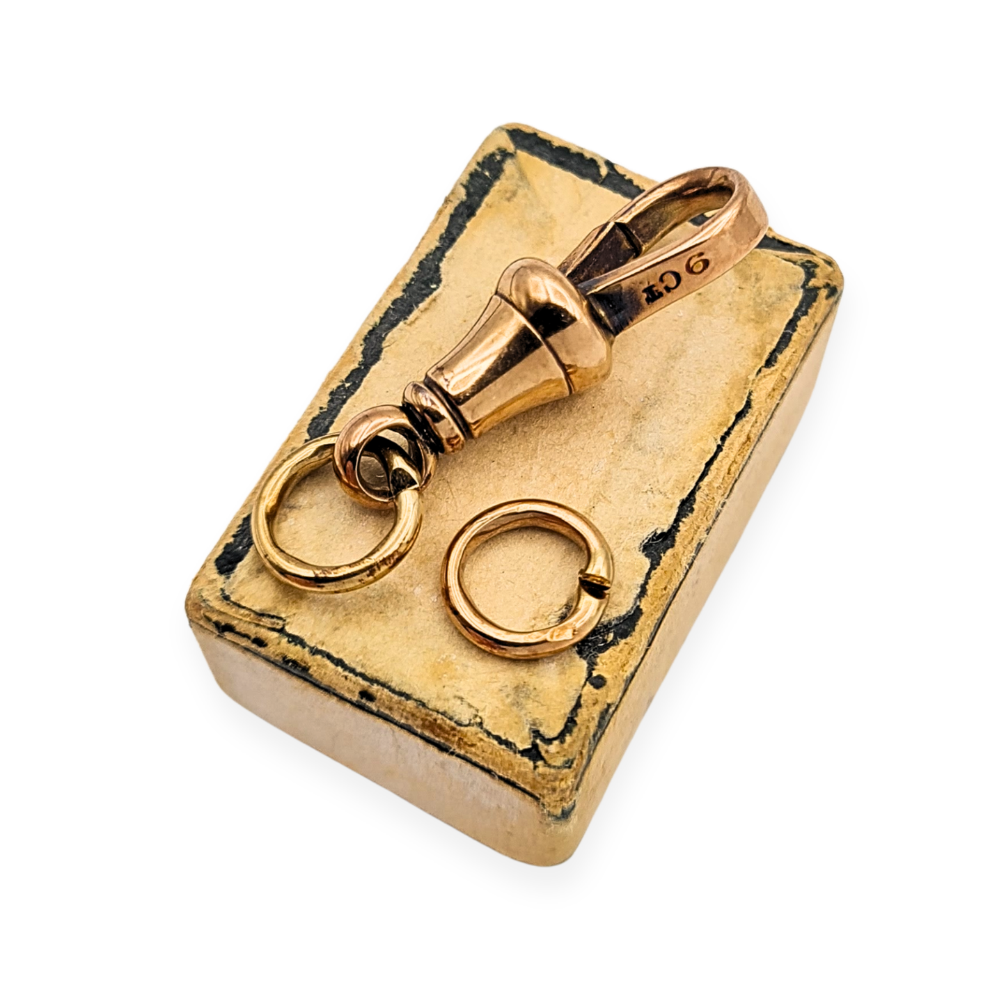 9ct rose gold dog clip clasp from an Albert chain, stamped and tested, measuring 22mm with two 7mm jump rings, antique gold chain fitting with warm rose tone, light age-related wear, suitable for watch chains or jewellery restoration.
