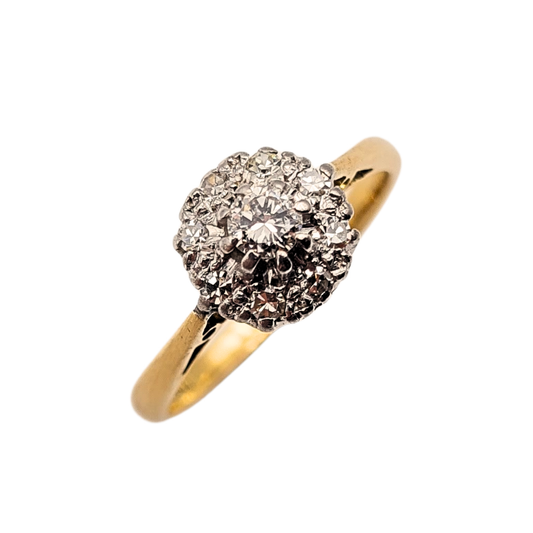 Close-up of a vintage 18ct yellow gold and platinum diamond cluster ring, stamped 18ct and fully tested. Tiny claw-set diamonds form a raised dome cluster on a slim yellow gold band. UK size I 1/2 (US 4 1/2), weighing 2.43g, elegant and refined.