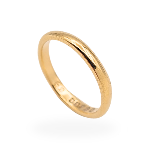 Vintage 9ct gold wedding band with London hallmark dated 1952, slim classic court profile ring measuring 2.3mm wide and weighing 1.7g, UK size I 1/2 and US size 4 3/4. A petite mid-century gold stacking or wedding ring with traditional British hallmarks.
