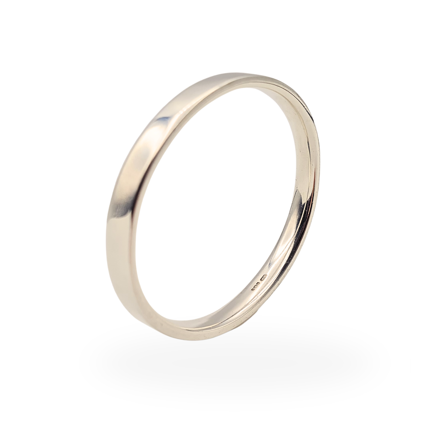 Solid 925 sterling silver oval bangle with smooth polished finish, measuring 7.75 inches internal circumference and 7.7mm wide, heavy 57.7g weight, hallmarked Sheffield 1992 with visible maker’s mark, classic slip-on design with comfortable fit profile