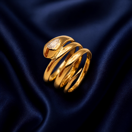 18ct solid gold four coil snake ring with pear shaped old cut diamond, Birmingham hallmarked, 7.40g